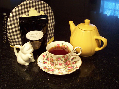 The little kitty creamer waits to add milk to that lovely tea!