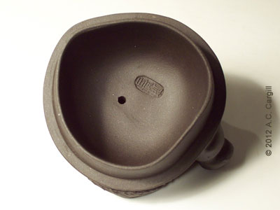 Chop mark one the under side of the lid