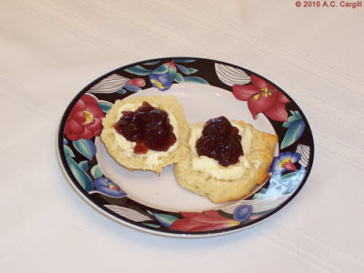 Hogging the last scone, smothered in clotted cream and jam, is not good manners! Hogging the last scone, smothered in clotted cream and jam, is not good manners!