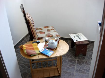 The balcony, set for tea for one The balcony, set for tea for one