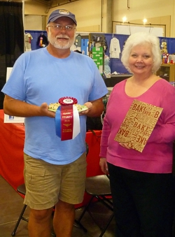 Jennifer Petersen presenting the Special Award Blue Ribbon, and $50 gift certificate from King Arthur Flour, to winner Ron Palmi at Clark County Fair. (Photo source: Jennifer Petersen) Jennifer Petersen presenting the Special Award Blue Ribbon, and $50 gift certificate from King Arthur Flour, to winner Ron Palmi at Clark County Fair. (Photo source: Jennifer Petersen)