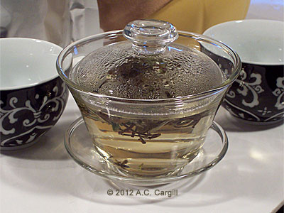 Tea soup in the making. A glass gaiwan lets you see all the action. (Photo source: A.C. Cargill, all rights reserved)