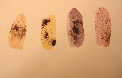 Taupe, cream, lavender, and pink nail polishes with tea leaf embellishment. (Photo source: article author)