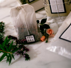 Tub Tea sachets — oversized tea bags filled with dried herbs, flowers, and citrus peels. (Source: screen capture from site)