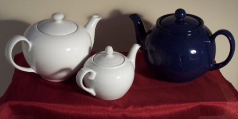 Even my teapots get in on the celebration, lining up for a red, white, and blue display! (Photo by A.C. Cargill, all rights reserved)